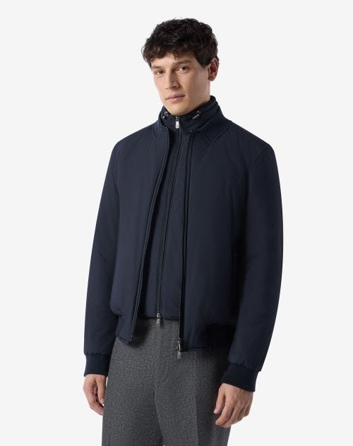 Navy blue padded bomber jacket with detachable chest piece